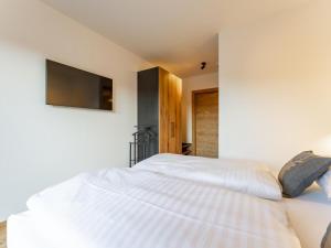 Postel nebo postele na pokoji v ubytování Grebenzen Lodge Hirsch