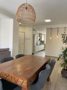 a large wooden table in a room with chairs at Aceni in Ciudad Real +18 photos