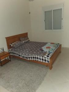 Ένα ή περισσότερα κρεβάτια σε δωμάτιο στο Appartement Confort Agadir