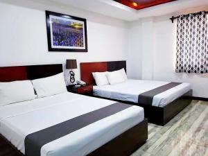 Postel nebo postele na pokoji v ubytování Hotel Gabriella