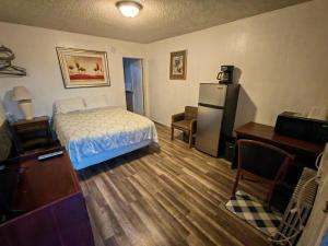 Postel nebo postele na pokoji v ubytování Cheyenne Motel