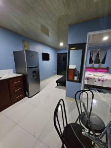 a room with a kitchen and a dining room at Departamento equipado in Nicoya