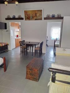 a living room with a table and chairs at Φως (Fos) in Astypalaia