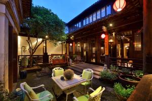 Fotografie z fotogalerie ubytování Blossom Hill Inn Zhouzhuang Seasonland v destinaci Jinjiaba
