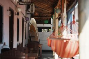 a restaurant with tables and chairs in a building at Romance in Bay in Arugam Bay