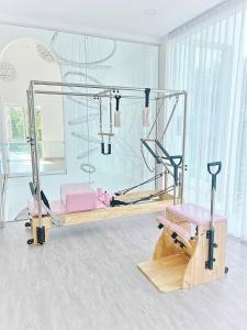 a room with a gym with a bed and a mirror at Luxury Pool Villa 99 in Ban Bang Krang