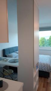 Postel nebo postele na pokoji v ubytování WUGE Bihac + 7 fotografií