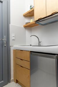 A kitchen or kitchenette at Helios Beach Studios