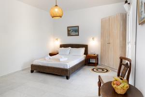 A bed or beds in a room at Helios Beach Studios