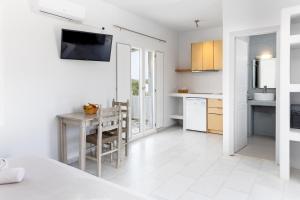 A kitchen or kitchenette at Helios Beach Studios