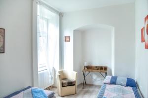 Un pat sau paturi într-o cameră la Zámecká zahrada-apartmány