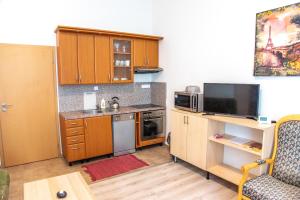 O bucătărie sau chicinetă la Zámecká zahrada-apartmány