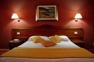 Voodi või voodid majutusasutuse Hotel Montecarlo toas