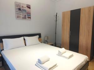 Posteľ alebo postele v izbe v ubytovaní Eleonas Apartments