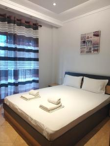 Posteľ alebo postele v izbe v ubytovaní Eleonas Apartments