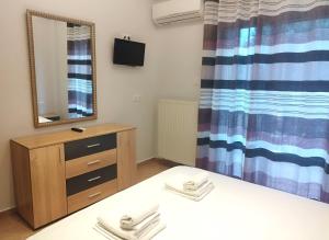 Posteľ alebo postele v izbe v ubytovaní Eleonas Apartments