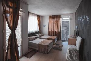 Postel nebo postele na pokoji v ubytování Guest House Taligarov