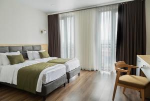 Voodi või voodid majutusasutuse Akhaltsikhe Inn toas