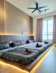 a bedroom with a large bed with a ceiling at The Wave - 3R3BR Duplex Penthouse l 10 Pax l Near Jonker l A23A15 in Melaka