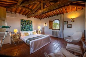 a bedroom with a large bed in a room at Villa dei Pavoni - Holiday Villa in Montauto +56 photos
