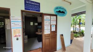 an entrance to a building with a sign above a door at Sabai Resort in Ao Nang Beach +171 photos