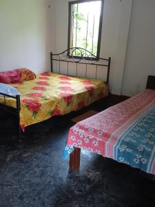 Ένα ή περισσότερα κρεβάτια σε δωμάτιο στο Ankita Residential Homestay