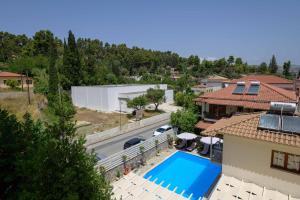 an aerial view of a house with a swimming pool at Neda Hotel in Olympia