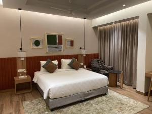 Postel nebo postele na pokoji v ubytování Regency Tuticorin by GRT Hotels