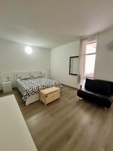 Giường trong phòng chung tại Piso F-Primavera GT +59 ảnh