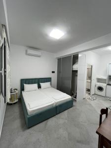 a bedroom with a large bed in a room at Villa LIKAJ in Berat