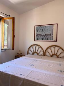 Postel nebo postele na pokoji v ubytování Appartamento Ilune IUN T4946