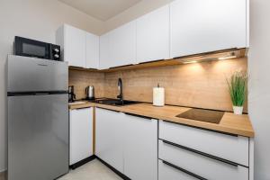 Η κουζίνα ή μικρή κουζίνα στο Apartman Dokić 2 +6 φωτογραφίες