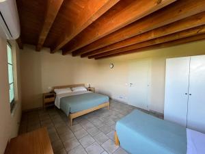 Posteľ alebo postele v izbe v ubytovaní Agriturismo il Fontanile