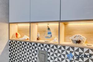 Η κουζίνα ή μικρή κουζίνα στο Apartament PASJA Gardenia Seaside - Aprent +4 φωτογραφίες