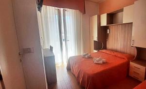 Postel nebo postele na pokoji v ubytování Hotel Sara