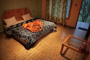 Yellowjackets Hostel Tosh客房内的一张或多张床位