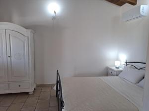 Postel nebo postele na pokoji v ubytování Agriturismo Sa Murta in Sennariolo-Oristano
