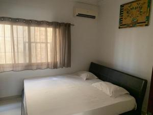Кровать или кровати в номере Appartement meuble +7 фотографий