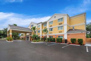a large building with a parking lot at Comfort Inn Fort Myers Northeast in Fort Myers