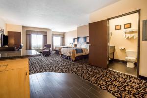 a hotel room with a bed and a bathroom at Comfort Inn Ballard-Roosevelt in Roosevelt