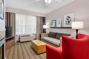 a living room with a couch and a tv at Country Inn & Suites by Radisson, Annapolis, MD in Annapolis