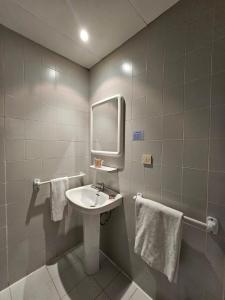Koupelna v ubytování Hotel Hipic + 35 fotografií