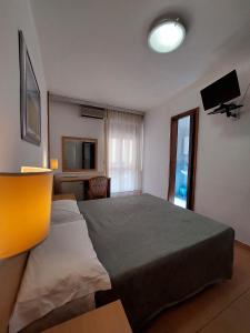 TV a/nebo společenská místnost v ubytování Hotel Nettuno
