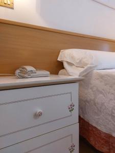 Ένα ή περισσότερα κρεβάτια σε δωμάτιο στο Hotel Nettuno