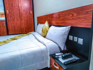 Ένα ή περισσότερα κρεβάτια σε δωμάτιο στο Hotel lewegri