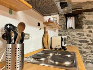 Køkken eller tekøkken på Abri des Cimes, dormire tra pietra e legno CIR 0124
