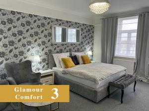 Postel nebo postele na pokoji v ubytování EFIPA Glamour Apartments