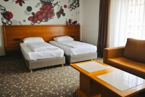 Ein Bett oder Betten in einem Zimmer der Unterkunft Hotel Piramida