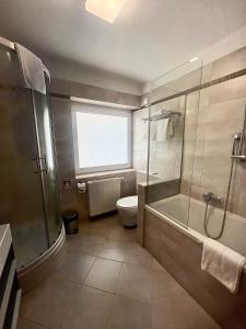 Ein Badezimmer in der Unterkunft Hotel Piramida