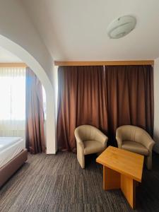 Ein Bett oder Betten in einem Zimmer der Unterkunft Hotel Piramida